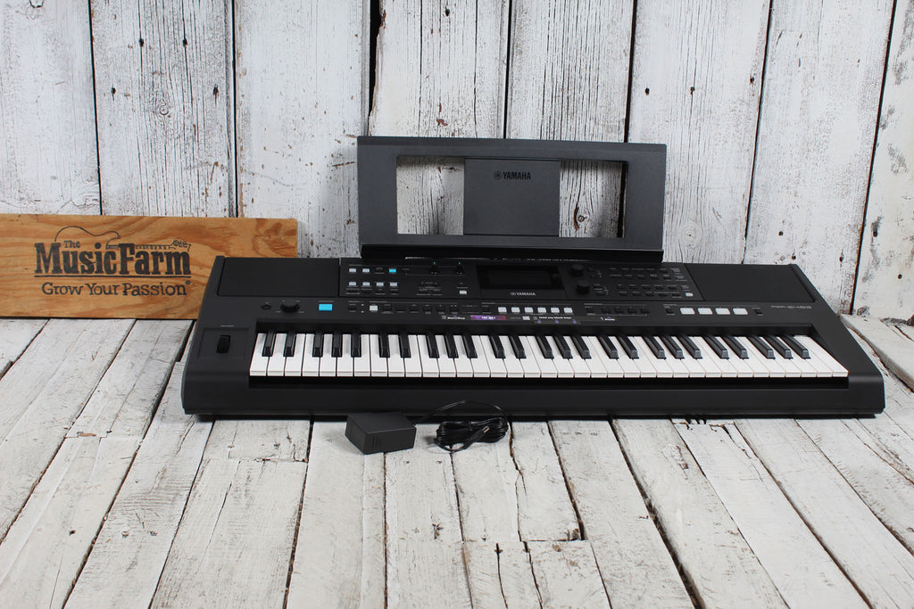 Yamaha PSR-E483 61 Key Portable Keyboard with Power Supply and Music Rest