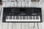 Yamaha PSR-E483 61 Key Portable Keyboard with Power Supply and Music Rest