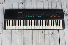 Load image into Gallery viewer, Casio Casiotone CT-607 Keyboard with Power Supply Manual and Original Box