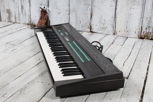 Yamaha Vintage 1980s DX7 Digital Synthesizer 61 Key Keyboard w Case & Cartridges